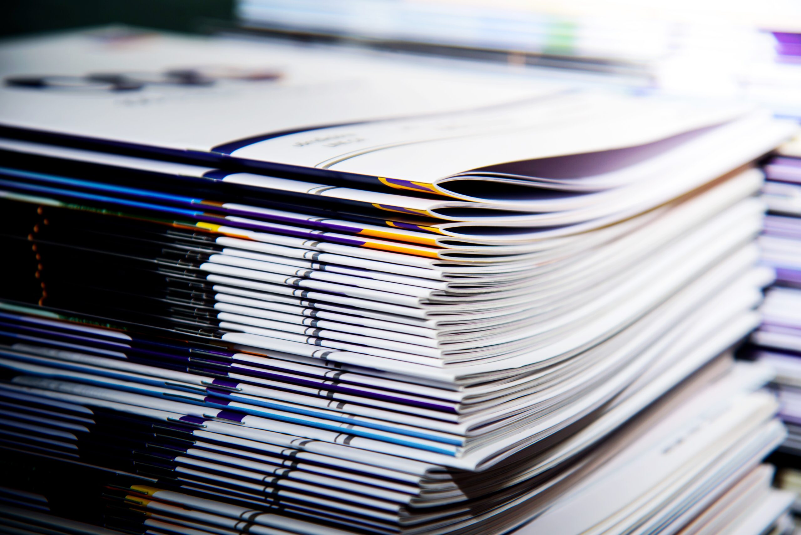 Stack of magazines featuring coupons and discount vouchers